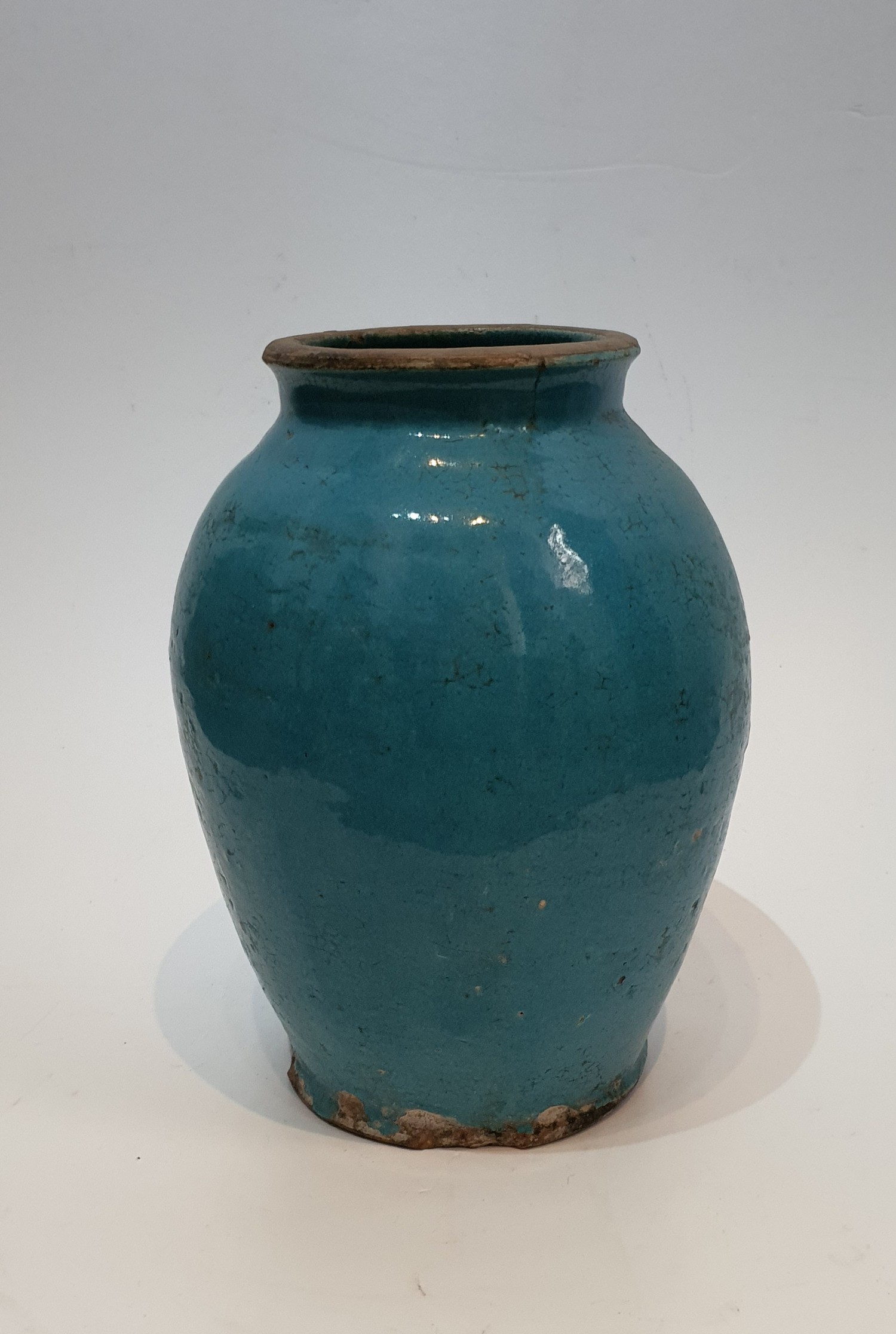 A 12th Century Islamic blue glaze ceramic jar. Unglazed lip and foot. H.25xW.18cm