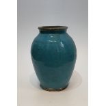 A 12th Century Islamic blue glaze ceramic jar. Unglazed lip and foot. H.25xW.18cm