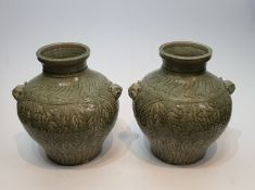 A pair of Chinese green celadon crackle glaze porcelain vases. Decorated with flowers and with