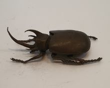 A Japanese cast bronze figure of a Rhinoceros Beetle, realistically modelled. H.12cm