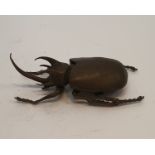 A Japanese cast bronze figure of a Rhinoceros Beetle, realistically modelled. H.12cm