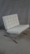 A Barcelona style easy chair in faux leather buttoned upholstery. H.39cm