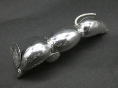 A Chinese silver pounce by Wah Hing in the form of a lotus root. Hallmarked WH, 90 and Chinese