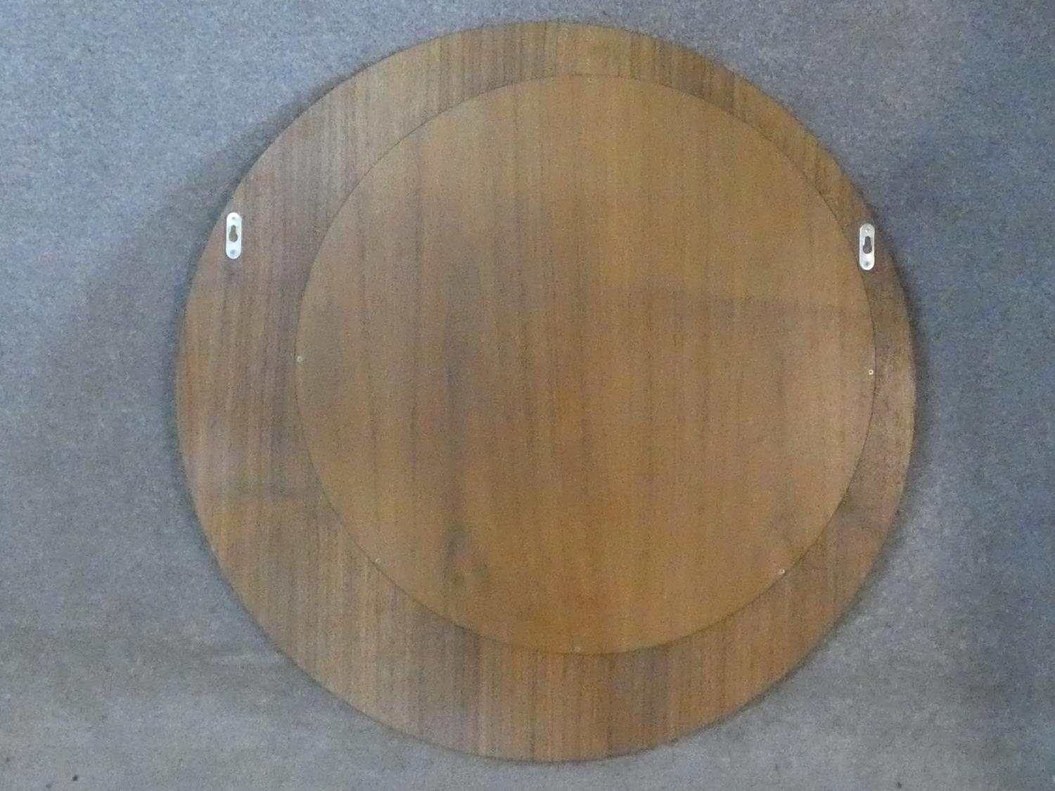 A contemporary wall mirror with off set circular plate. D.75cm - Image 4 of 4