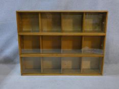Three mid century vintage teak Unix sectional stacking bookcases with twin glass sliding doors and