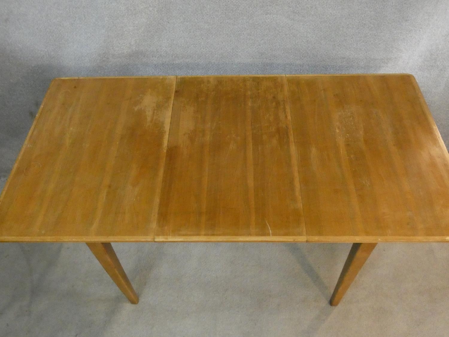 A mid century vintage teak dining table with extra leaf on square tapering supports. H.76 L.154 W. - Image 2 of 5
