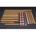 A collection of seventeen vintage wooden rulers, some with makers marks and stamps. L.61cm (Longest)