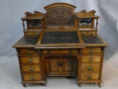 A late 19th century Dickens style desk by Thomas Turner of Manchester in oak and pollard oak with