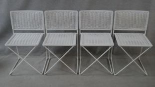 A set of four side chairs with woven seats on metal cross framed supports. H.76cm