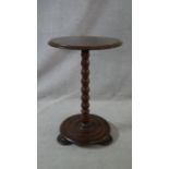 A Victorian mahogany lamp table on bobbin turned column on platform base. H.65 L.43 W.43cm
