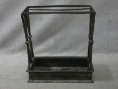 A vintage cast iron stick and umbrella stand with two long sections and lattice design ends. H.62