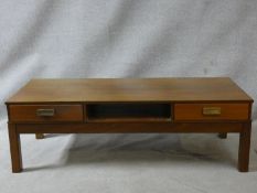 A vintage teak low coffee table fitted with frieze drawers. H.40 W.125 D.51cm