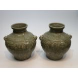 A pair of Chinese green celadon crackle glaze porcelain vases. Decorated with flowers and with