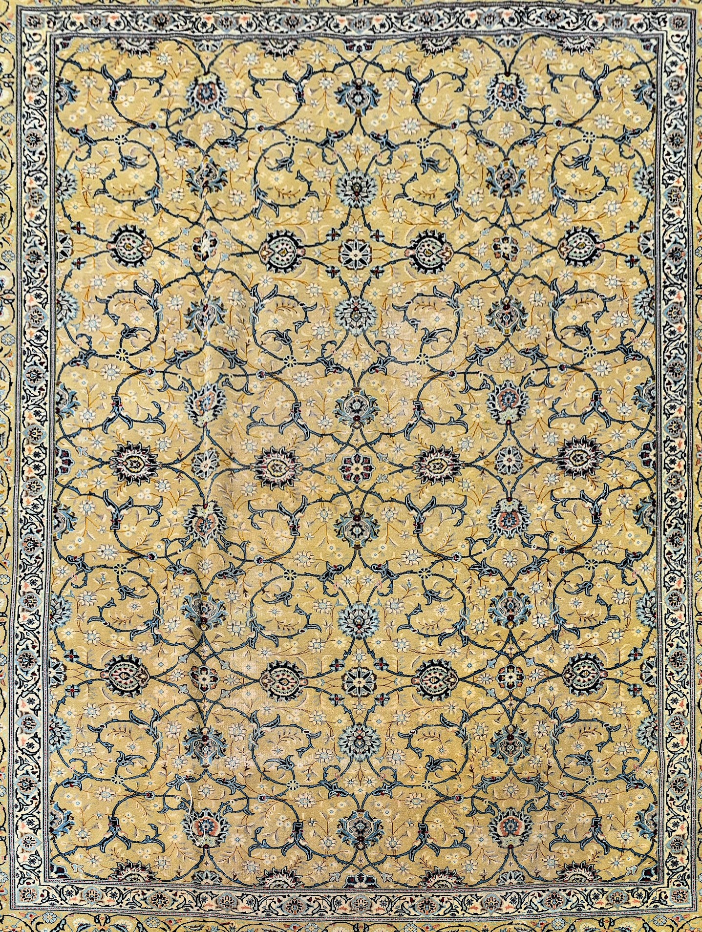 A Persian Kashan carpet with palmettes and scrolling foliate design on a biscuit ground contained by - Image 2 of 4
