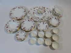 A Mintons Ancestral pattern hand painted porcelain part dinner service, five dinner plates, side