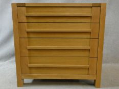 A contemporary pegged and jointed oak chest of four long drawers. H.88 W.90 D.46cm