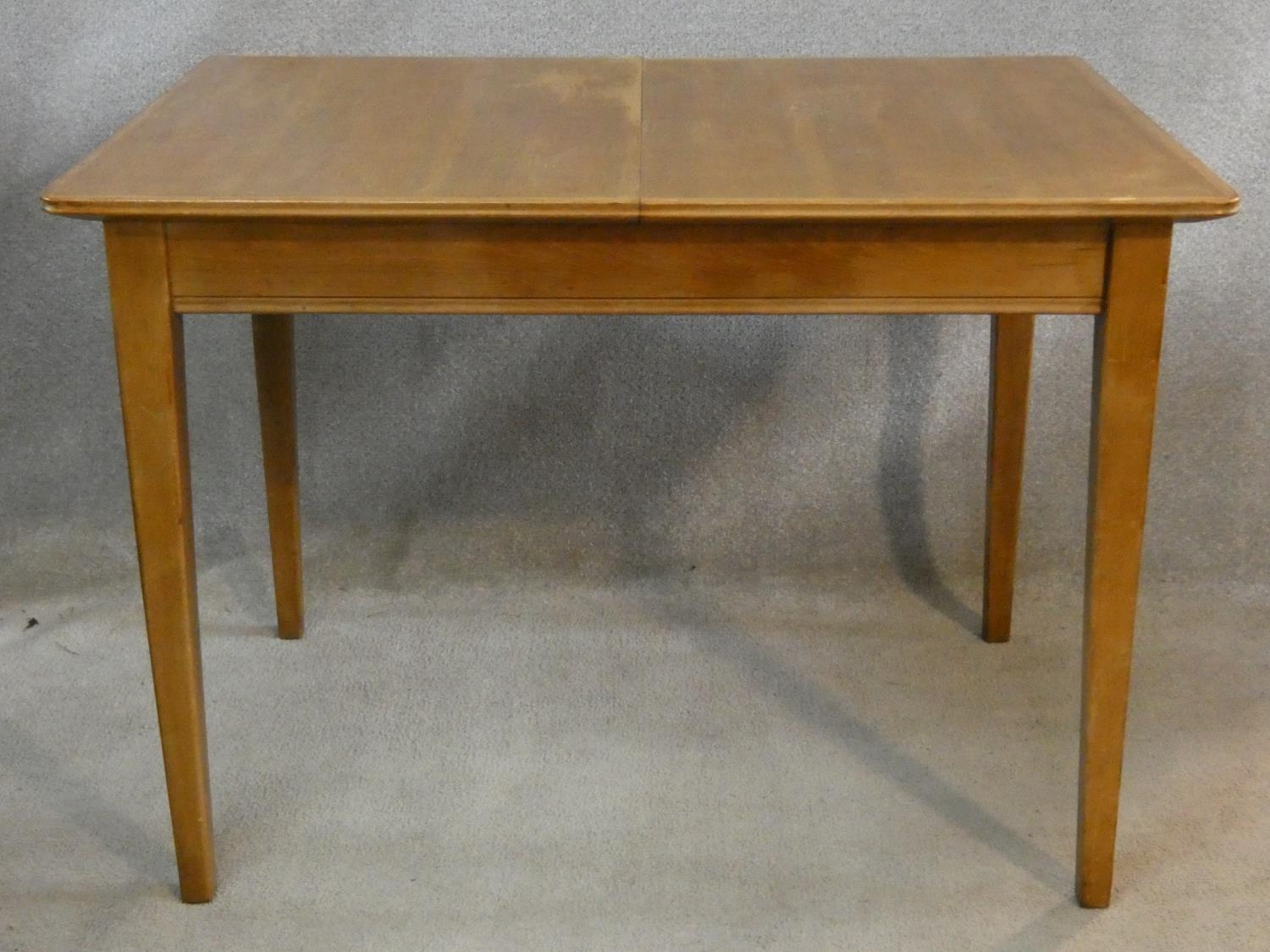 A mid century vintage teak dining table with extra leaf on square tapering supports. H.76 L.154 W. - Image 3 of 5