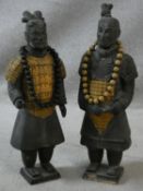Two Tang style black terracotta warriors with gilded detailing to the armour. Both wearing wooden