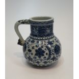 A Chinese blue and white Islamic market pattern porcelain jug/tankard with scrolling form handle