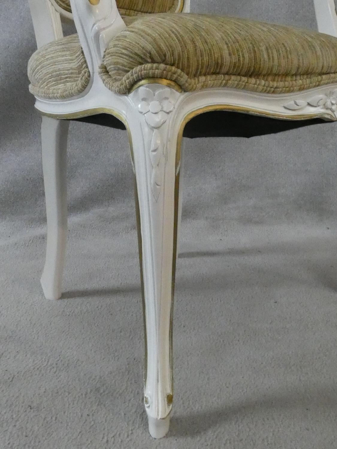 A set of eight Louis XV style distressed painted and gilt dining chairs in fawn upholstery on - Image 4 of 13