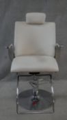 A retro styled adjustable swivel barbers chair in faux leather upholstery and aluminium frame. H.