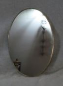 A vintage brass framed wall mirror. H.70 W.46cm