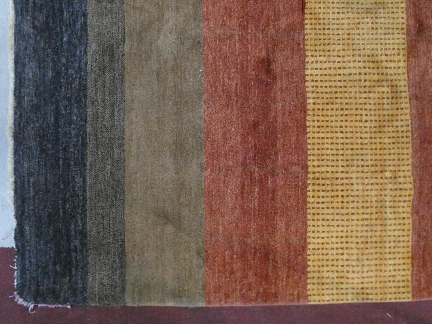 A woollen carpet with polychrome bands. L.250 W.170cm - Image 2 of 4