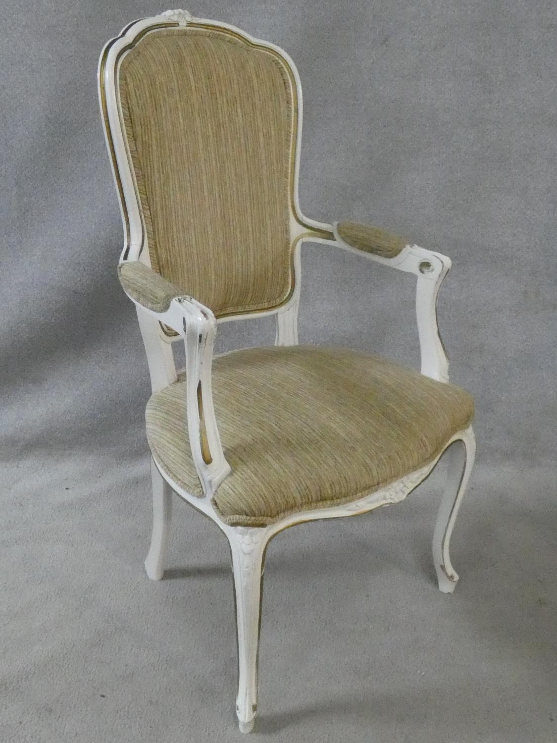 A set of eight Louis XV style distressed painted and gilt dining chairs in fawn upholstery on - Image 3 of 13