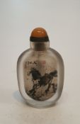 A Chinese reverse painted glass snuff bottle decorated with horses and Chinese character marks, with