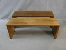 A pair of contemporary hardwood benches with planked top and supports. H.46.5 L.125.5 W.35cm