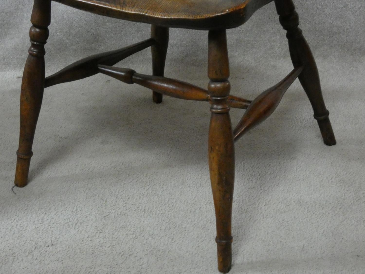 A 19th century beech framed armchair with moulded elm seat on turned stretchered supports. H.87cm - Image 5 of 8
