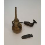 A collection of Indian brass items, including a brass two handled rose water sprinkler, a padlock in