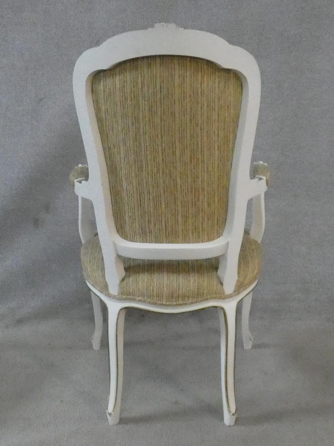 A set of eight Louis XV style distressed painted and gilt dining chairs in fawn upholstery on - Image 8 of 13