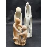 A collection of three carved and pierced soapstone figure groups. H.29cm