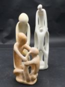 A collection of three carved and pierced soapstone figure groups. H.29cm