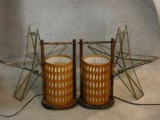 A pair of gilt metal framed glazed star shaped candle holders and a pair of Chinese style table