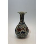 A large Chinese Yuan style blue and white porcelain vase with iron red glaze, decorated with