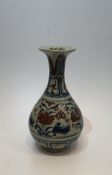 A large Chinese Yuan style blue and white porcelain vase with iron red glaze, decorated with