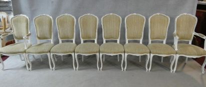 A set of eight Louis XV style distressed painted and gilt dining chairs in fawn upholstery on
