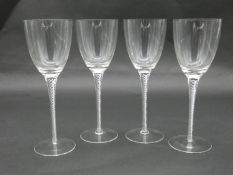 Four blown glass double air twist stem wine glasses with rounded feet. H.19cm