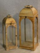 A large painted pine domed top storm lantern and a smaller similar. H.75cm