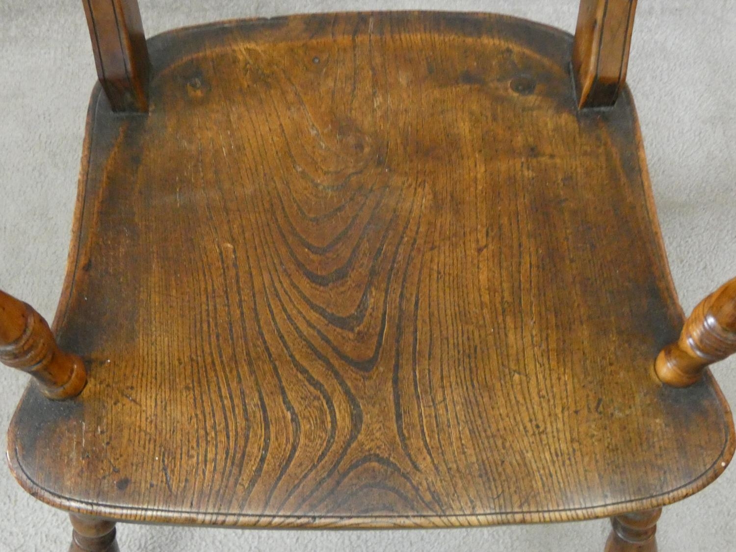 A 19th century beech framed armchair with moulded elm seat on turned stretchered supports. H.87cm - Image 4 of 8