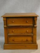 A 19th century Continental bedside chest of three drawers on plinth base. H.63 W.63 D.43cm
