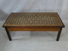 An Indian carved hardwood and ebonised low table fitted with drawers to each end. H.46 L.122 W.61cm