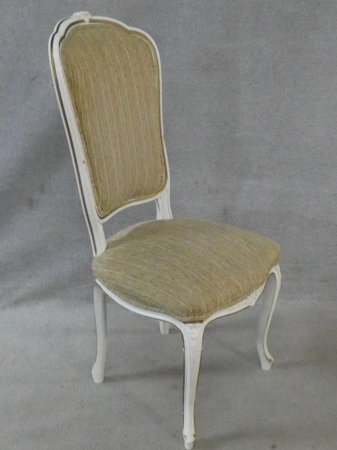 A set of eight Louis XV style distressed painted and gilt dining chairs in fawn upholstery on - Image 12 of 13