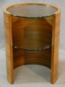 A contemporary circular two tiered occasional table with plate glass top and undertier. H.60 W.45cm