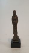 An early Oriental bronze goddess on a square base. H.10.5cm