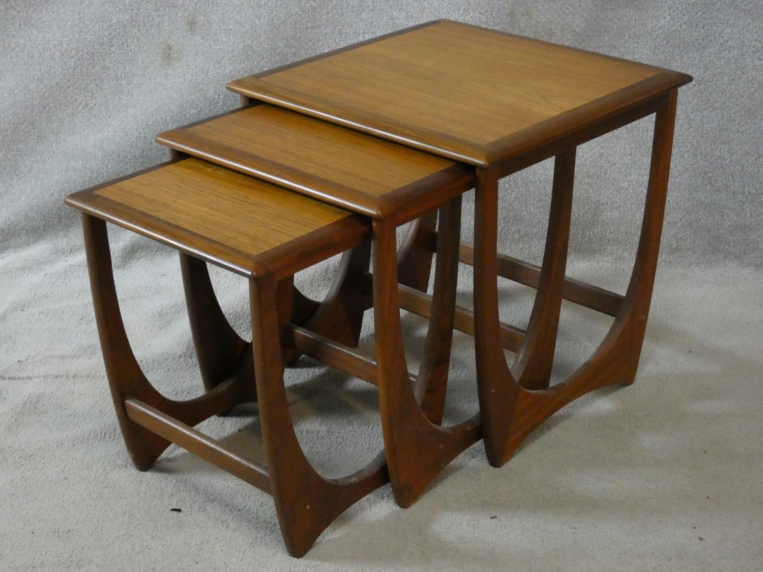A nest of three mid century vintage teak G-Plan style graduating occasional tables. H.51 L.50 W.50cm