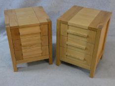 A pair of contemporary pegged and jointed three drawer oak bedside chests with makers stamp to the