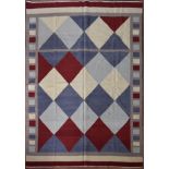A Kilim with all over diamond design within a cube and banded border. L.239xW.179cm